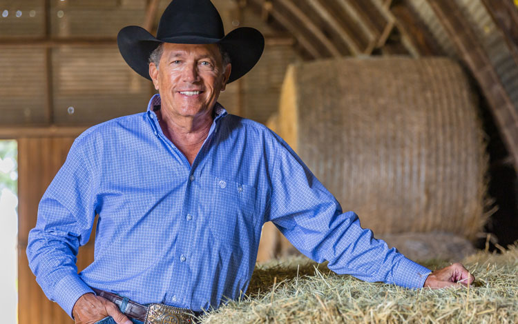 George Strait smiling for the camera.